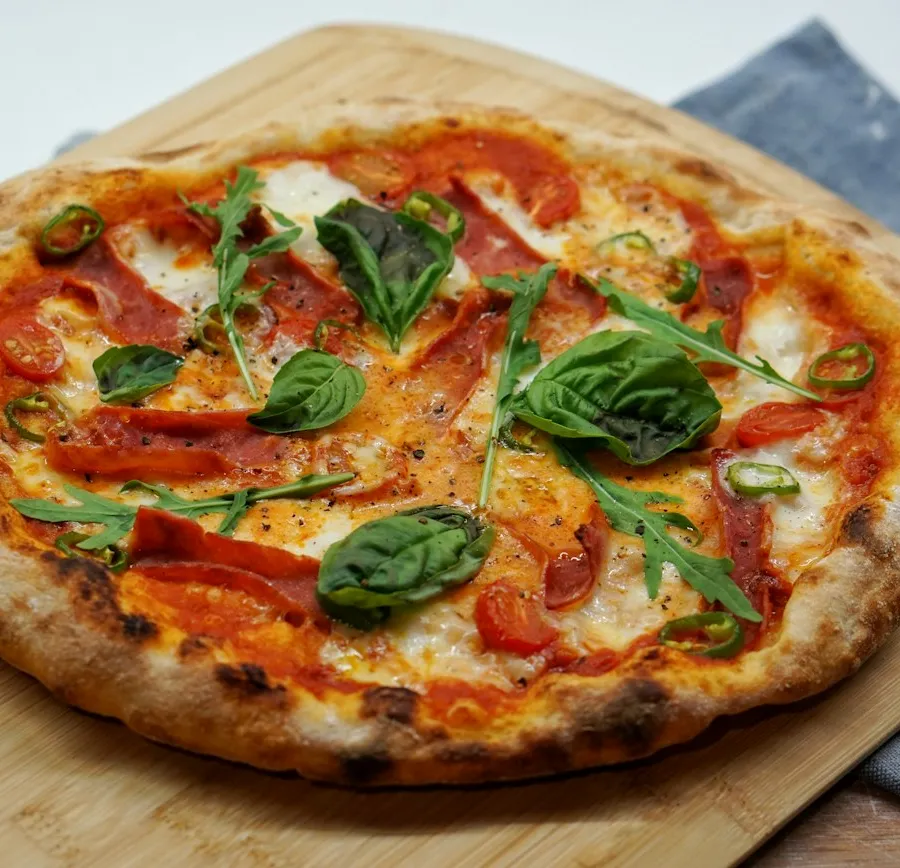 Pizza with basil and tomato
